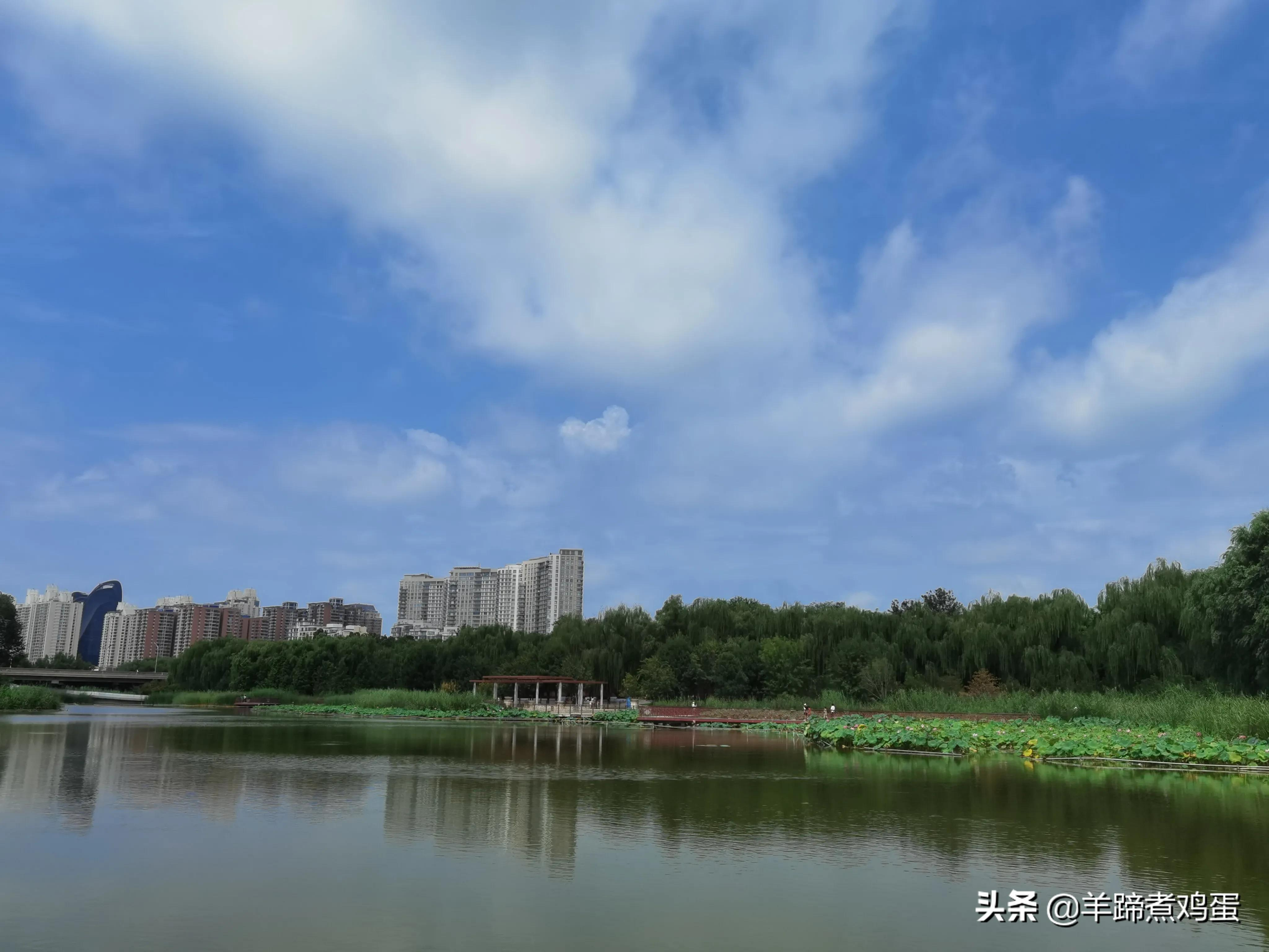 淫雨唤云行日隐耀霞红--雨后北京云空的美丽身影留下霞浓