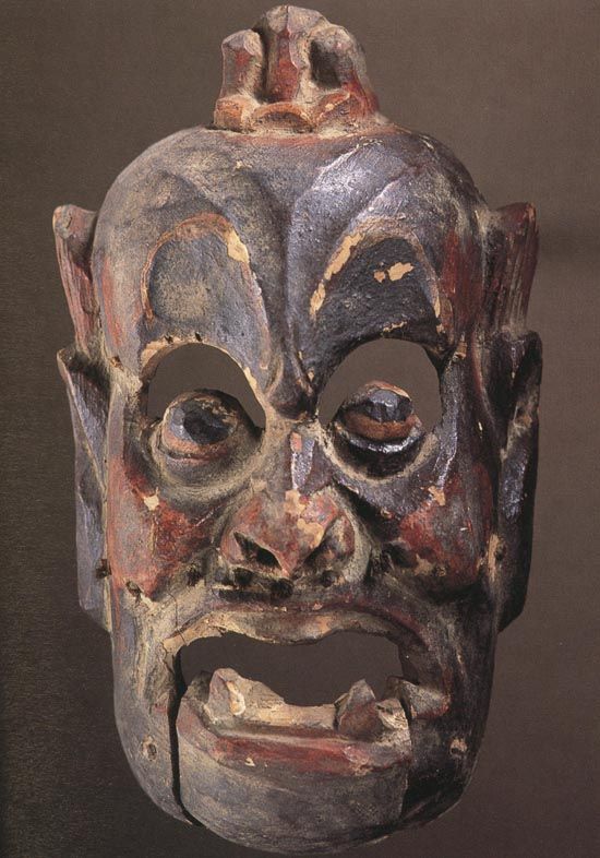 描写古代精致的面具图片