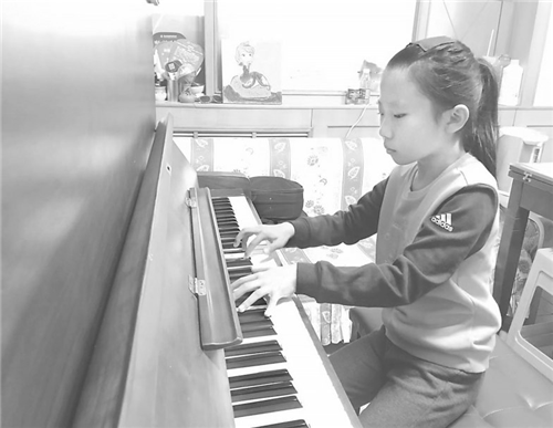 我市9岁琴童考过中央音乐学院钢琴九级