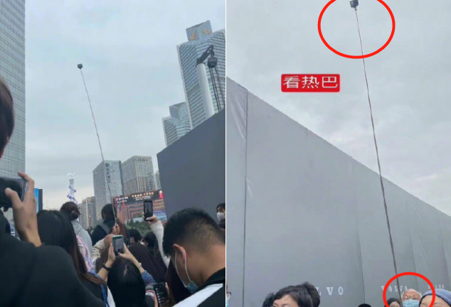 热巴穿开叉裙出席活动!大爷举3米长杆拍照,五六名保镖围在身侧